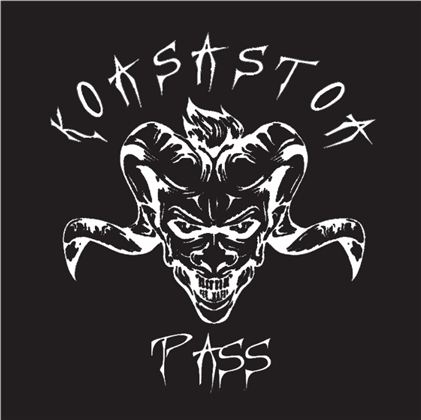 A graphic motif featuring a demonic face with impressive horns. The inscription "Korasator Pass" complements the design.