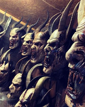 A series of creepy masks with horns and distorted faces. The masks look dark and terrifying.