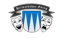Ein Logo der Heimatbühne Going mit zwei Theatermasken, die Freude und Traurigkeit darstellen. Im Hintergrund ist ein Wappen mit blauen und weißen Elementen.