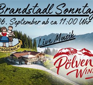 An inviting event poster for Brandstadt Sunday. It features a picturesque mountain landscape with a cozy mountain cabin and information about live music and the event date.