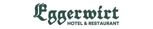 Een logo van Eggerwirt Hotel & Restaurant. De tekst is in een traditionele, gestileerde stijl uitgevoerd.