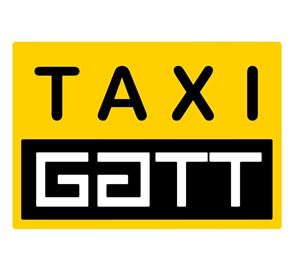 Ein gelbes Schild mit der Aufschrift "TAXI" und "GATT" in schwarzer Schrift. Es dient als Erkennungszeichen für ein Taxiunternehmen.
