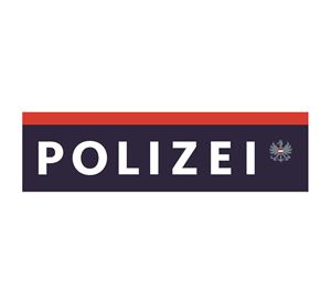 Een logo van de politie in een eenvoudige, grafische weergave. Het toont de tekst "POLIZEI" in blauwe kleur met een rode bovenrand.