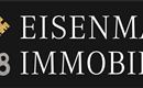 Ein Logo von Eisenmann Immobilien. Es zeigt zwei Schlüssel in Gold und Blau auf schwarzem Hintergrund.