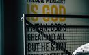 A modern room with a wall displaying text written in English. The text focuses on Freddie Mercury and contains a strong personal opinion.