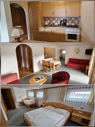 Eine gemütliche Wohnung mit einer voll ausgestatteten Küche und einem Essbereich. Der Wohnbereich ist hell und freundlich mit einem Schlafraum im Hintergrund.