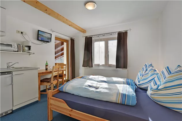 Appartement Kitzbüheler Horn Wohnküche und Schlafz