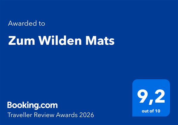 Auszeichnung für das Hotel "Zum Wilden Mats" mit einer Bewertung von 9,2 von 10. Verliehen von Booking.com für die Traveller Review Awards 2026.