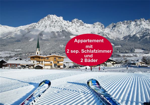 A picturesque winter landscape with snow-covered mountains and a charming village in the foreground. The image features skis pointing to a perfectly groomed slope.