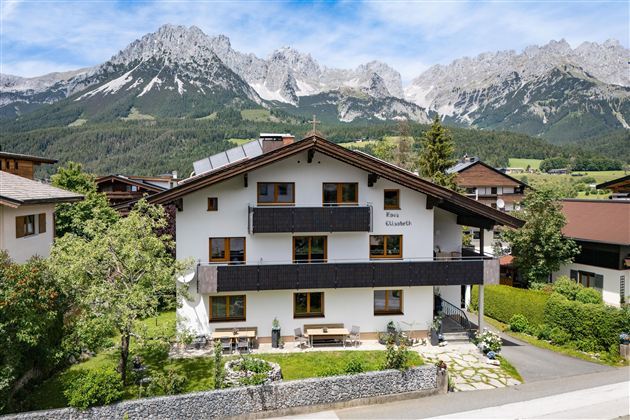A charming building, our HOUSE ELISABETH, set against an impressive mountain backdrop of the Wild Kaiser in Ellmau.