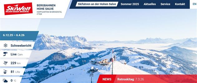 Een adembenemend berglandschap met met sneeuw bedekte toppen en een heldere blauwe lucht. Perfect voor skiën en winteractiviteiten.