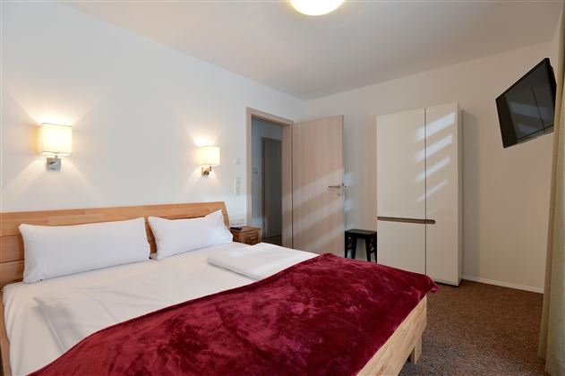 Söll Appartements-W20-Schlafzimmer Wilder Kaiser