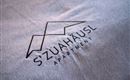 A modern logo for the apartment "S'ZuaHäusl". The design is simple and elegant on a gray background.