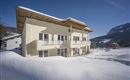 Appartementhaus Wanishof Thiersee Winteransicht