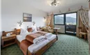 Söll_Hotel_AlpenSchlössl_Zimmer_WilderKaiser