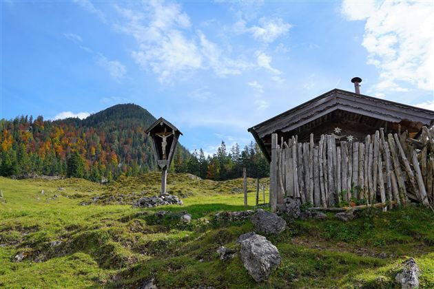An idyllic landscape with a traditional cottage