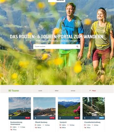 A website for hiking with pictures of various routes. It shows happy hikers in a green landscape.