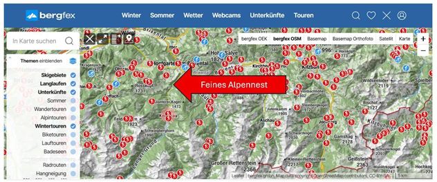 Eine Übersichtskarte mit verschiedenen Skigebieten und Wanderwegen. Der Punkt "Feines Alpengnest" ist hervorgehoben.
