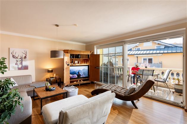 Living Room with sunny Balcony